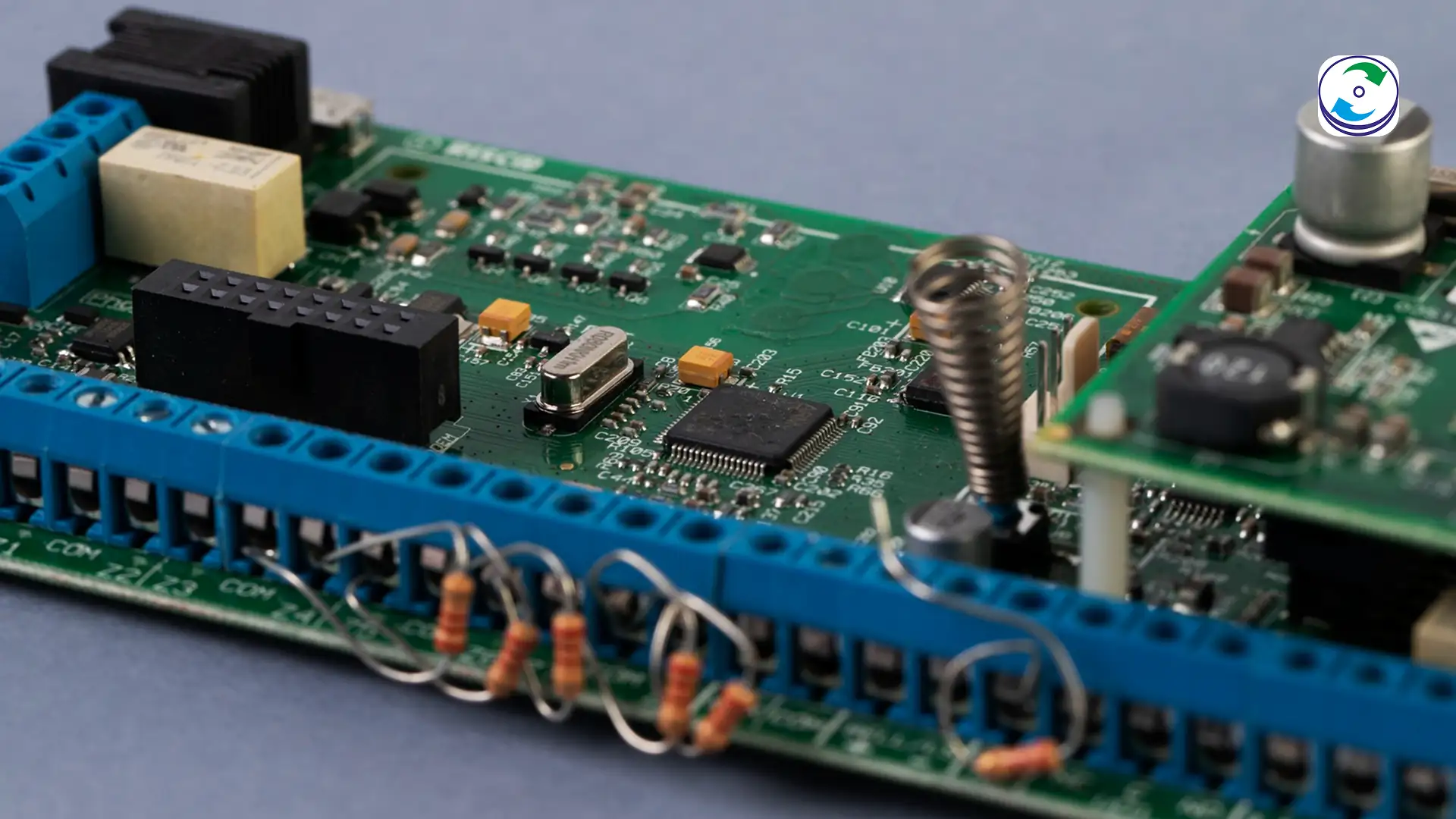 Micro-clamp attached to a tiny SPI Flash memory chip on a smart lock PCB.