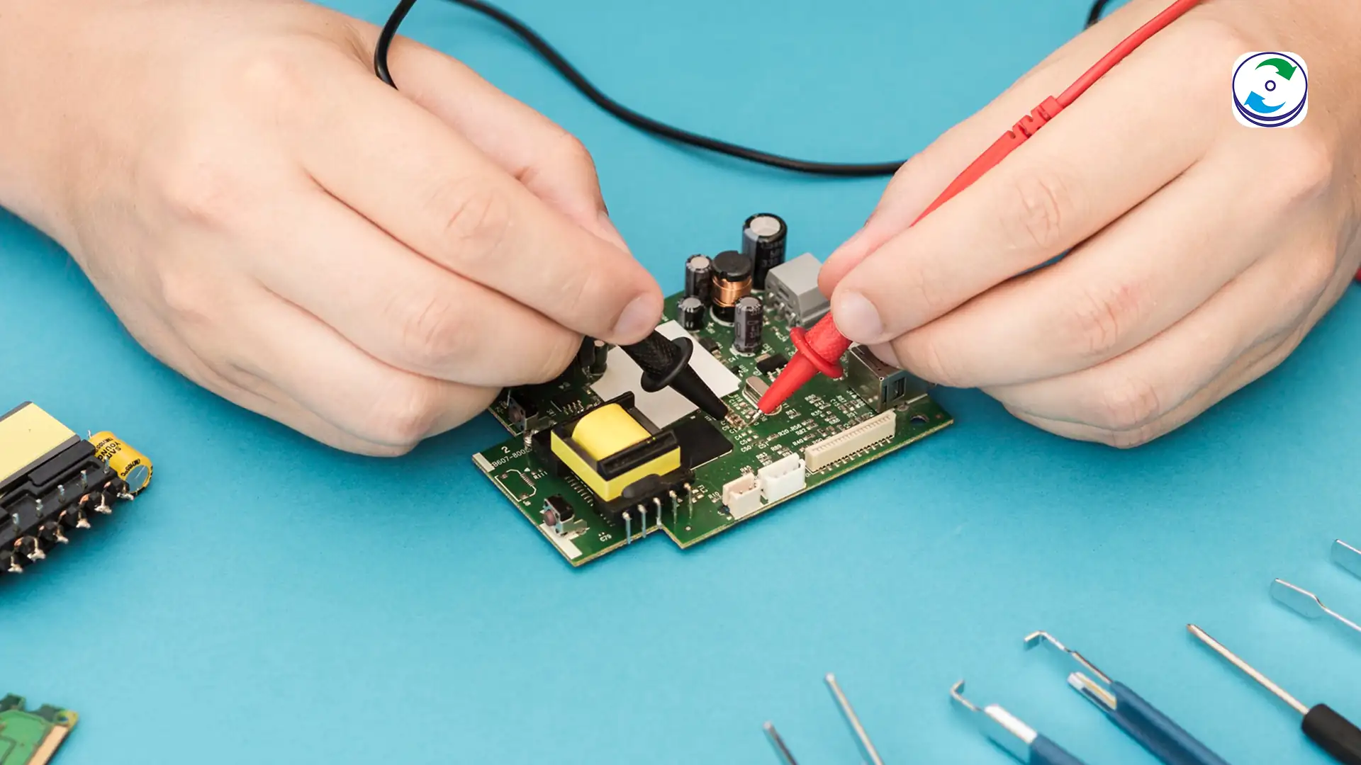 Technician attaching micro-wires to JTAG test points on an embedded device circuit board.