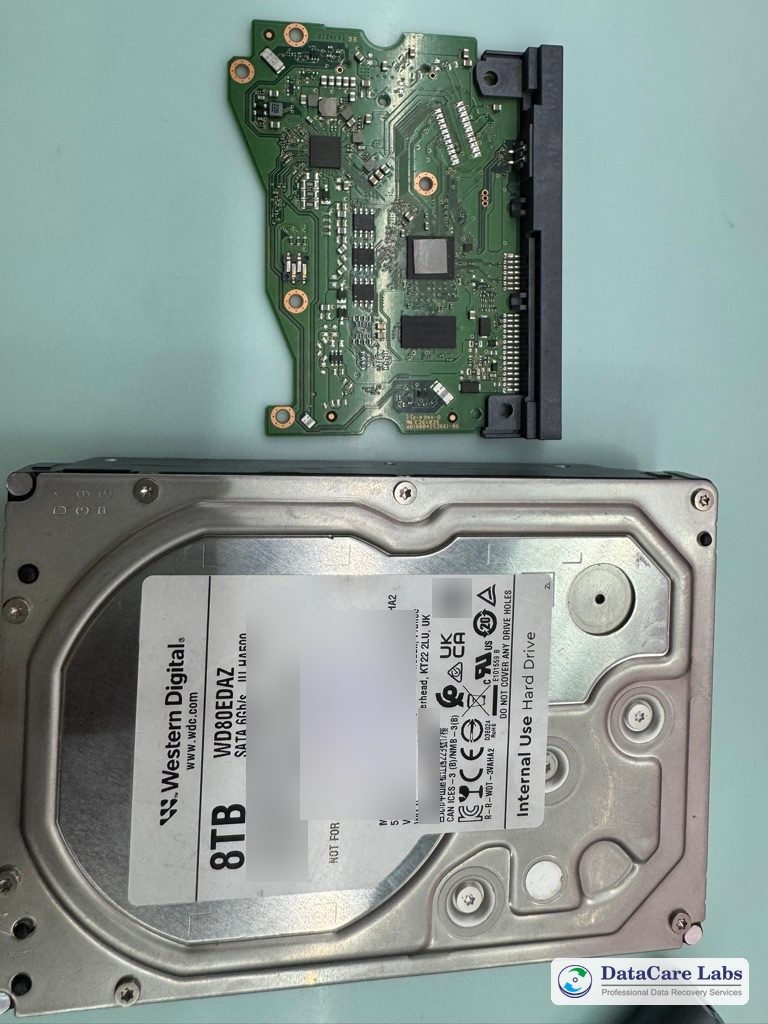 WD 8TB WD80EDAZ hard drive with its circuit board removed at the DataCare Labs lab Dropped hard drive data recovery: WD 8TB WD80EDAZ with its circuit board removed at the DataCare Labs lab